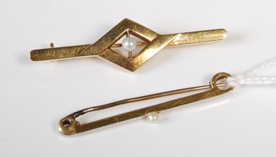 Lot 60 - A vintage white and yellow metal bar brooch...