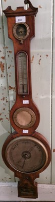 Lot 633 - An antique mahogany barometer with satinwood...