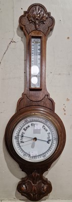 Lot 634 - An antique oak cased mercury filled barometer.