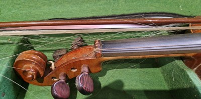 Lot 640 - An antique violin in a fitted black case, with...