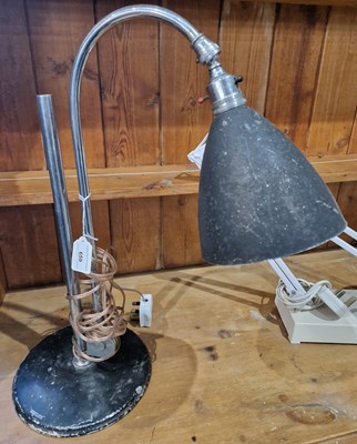 Lot 659 - A black and chrome industrial style lamp by...