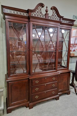 Lot 665 - A large reproduction stained wood breakfront...