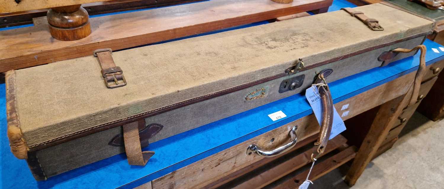 Lot 679 - A vintage canvas and leather lined gun case,...