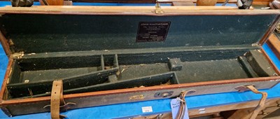 Lot 679 - A vintage canvas and leather lined gun case,...