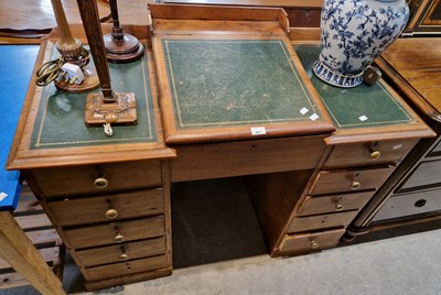 Lot 681 - An antique stained pine kneehole writing desk,...