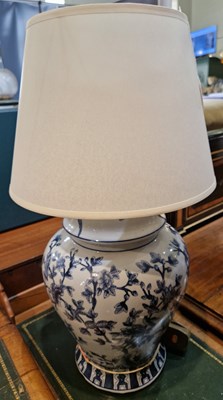 Lot 683 - A decorative blue and white lamp decorated...