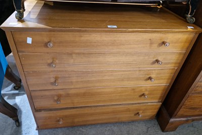 Lot 687 - A mid-century teak chest of five long...