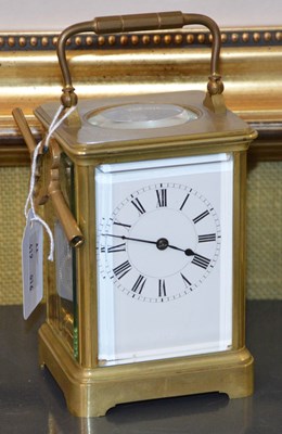 Lot 211A - A French brass carriage clock, the black and...