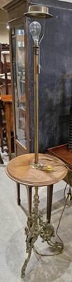 Lot 708 - A vintage brass standard lamp centred with a...