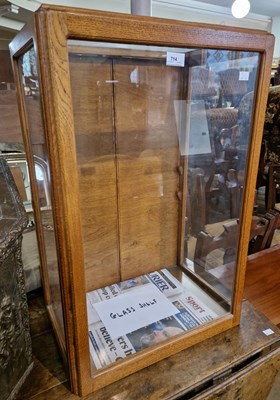 Lot 714 - A 20th century three quarter glazed display...