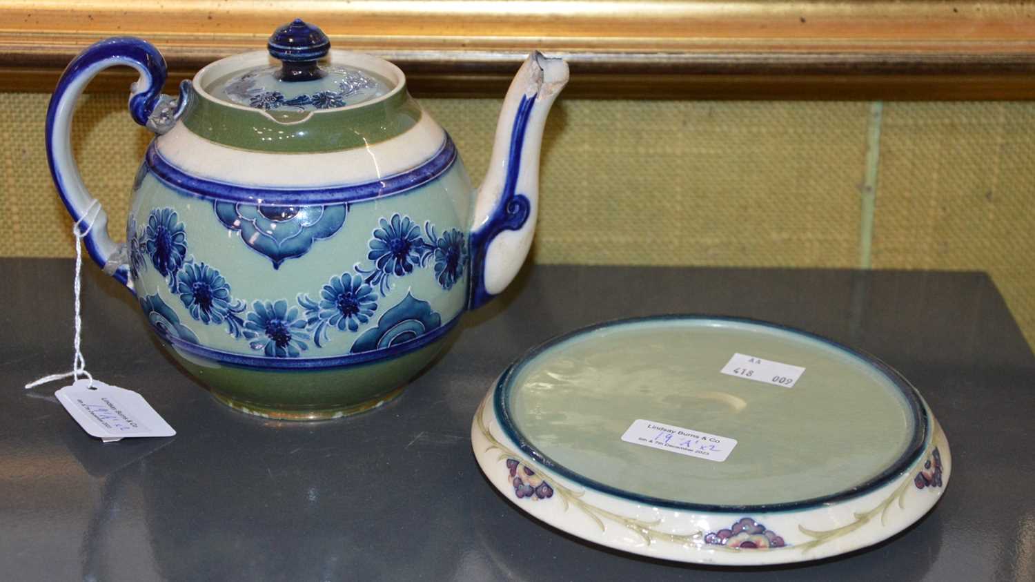 Lot 19 - A Macintyre Moorcroft green ground teapot and...