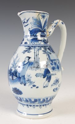 Lot 557 - A Chinese porcelain blue and white jug, Qing...