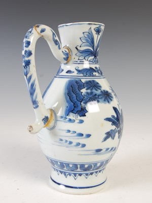 Lot 557 - A Chinese porcelain blue and white jug, Qing...