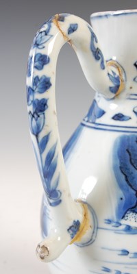 Lot 557 - A Chinese porcelain blue and white jug, Qing...