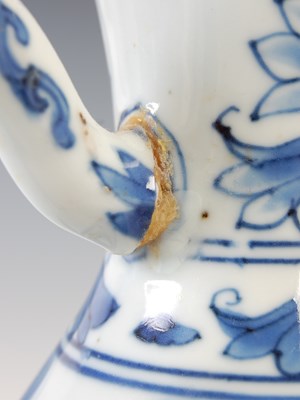 Lot 557 - A Chinese porcelain blue and white jug, Qing...