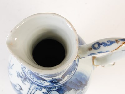 Lot 557 - A Chinese porcelain blue and white jug, Qing...