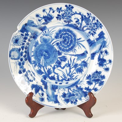 Lot 558 - A Chinese porcelain blue and white plate, Qing...