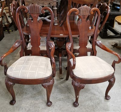 Lot 733 - A mid-century mahogany extending dining table...