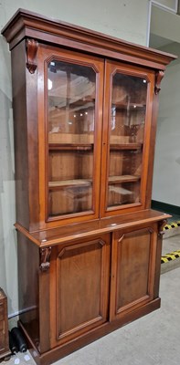 Lot 743 - A 20th century mahogany bookcase, the moulded...