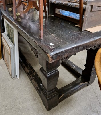 Lot 751 - An antique stained oak refectory table raised...