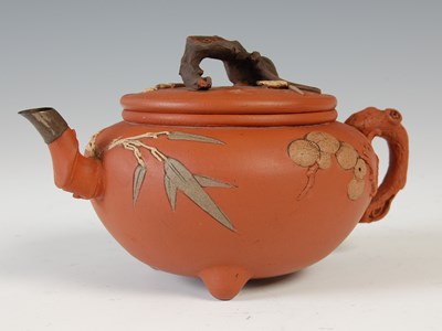 Lot 562 - Three Chinese Yixing tea pots and covers, the...