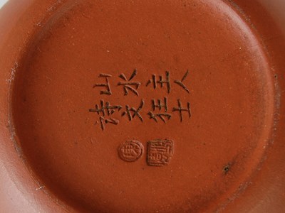 Lot 562 - Three Chinese Yixing tea pots and covers, the...