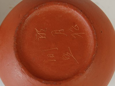 Lot 562 - Three Chinese Yixing tea pots and covers, the...