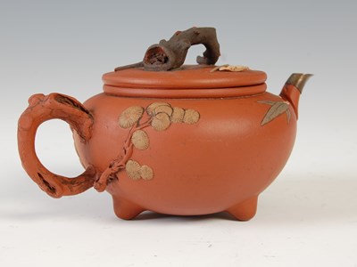 Lot 562 - Three Chinese Yixing tea pots and covers, the...