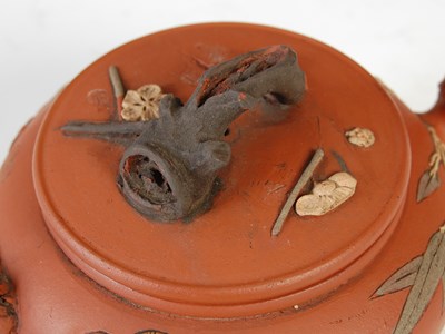 Lot 562 - Three Chinese Yixing tea pots and covers, the...