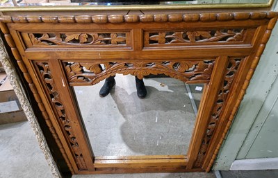 Lot 628 - An ornately carved and pierced wood...