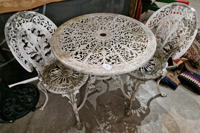 Lot 856 - A garden patio set comprising white-painted...