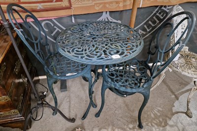 Lot 855 - A green-painted cast metal patio set...