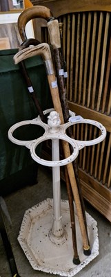 Lot 784 - A 20th century white enamelled stick/ parasol...