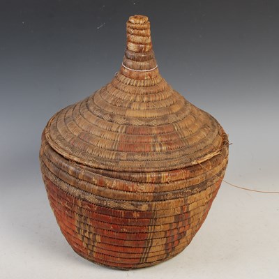 Lot 343 - Tribal Art - an early 20th century basket and...