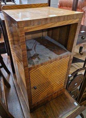 Lot 809 - A mid-century rippled veneered bedside cabinet...