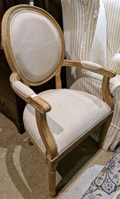 Lot 818 - A French style limed oak shabby-chic elbow...