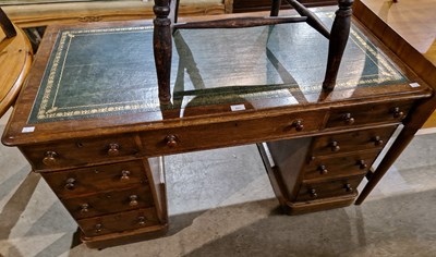 Lot 823 - A 19th century oak twin pedestal desk, green...