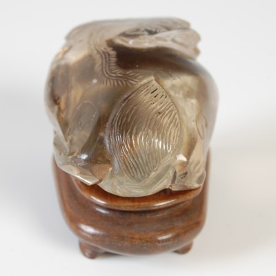 Lot 579 - A Chinese rock crystal carving of a Shishi dog,...