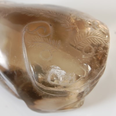 Lot 579 - A Chinese rock crystal carving of a Shishi dog,...