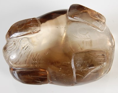 Lot 579 - A Chinese rock crystal carving of a Shishi dog,...