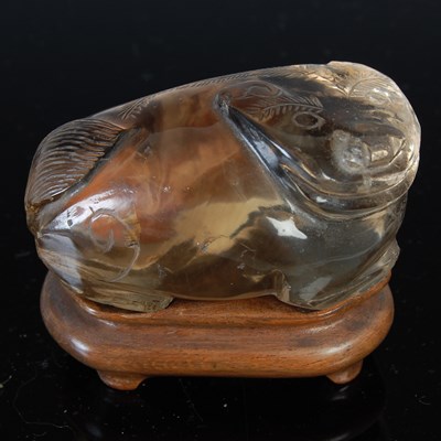 Lot 579 - A Chinese rock crystal carving of a Shishi dog,...