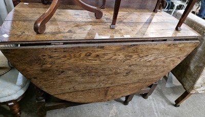 Lot 833 - An 18th century oak dropleaf gateleg table...