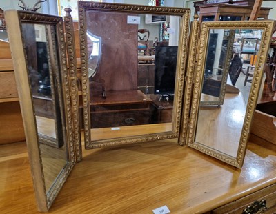 Lot 740 - A gilt framed triple plate dressing table mirror.