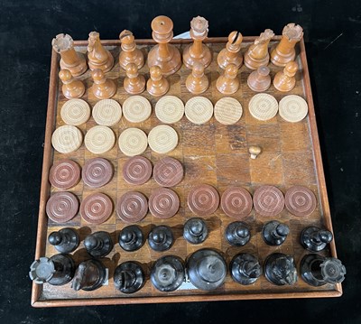 Lot 245 - An early 20th century wooden draughts board...