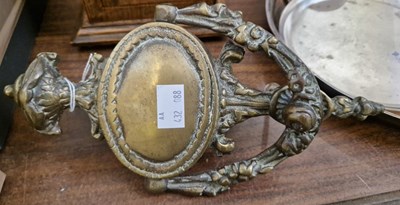 Lot 257 - A vintage brass Neoclassical style door knocker.