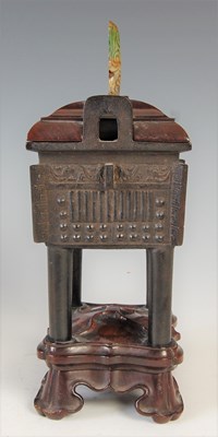 Lot 583 - A Chinese bronze archaic style Ding and wood...
