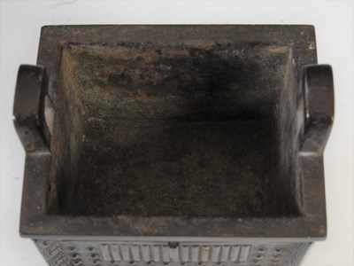 Lot 583 - A Chinese bronze archaic style Ding and wood...