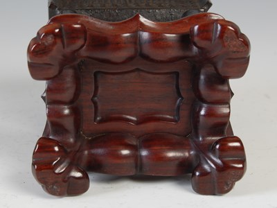 Lot 583 - A Chinese bronze archaic style Ding and wood...