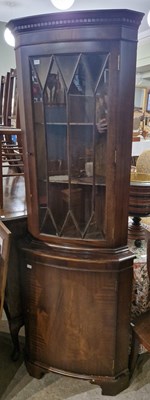 Lot 714 - A reproduction mahogany corner cupboard, the...