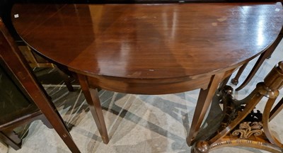 Lot 720 - A 19th century mahogany demilune table raised...